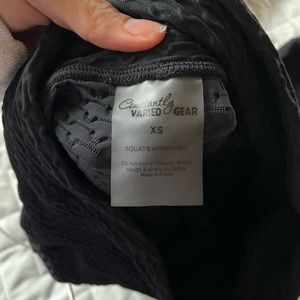Constantly Verified Gear (CVG) black textured leggings.